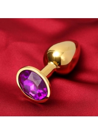 Золотистая анальная пробка с фиолетовым кристаллом - Сима-Ленд - купить с доставкой в Екатеринбурге