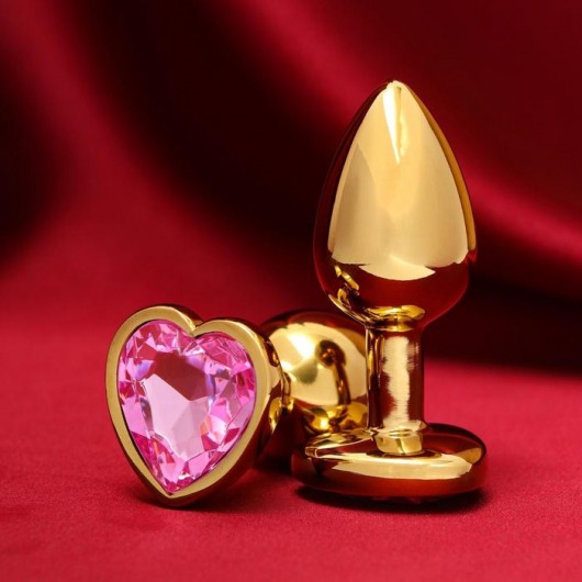 Золотистая анальная пробка с розовым кристаллом в форме сердца - 7 см. - Сима-Ленд