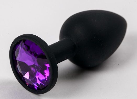 Черная силиконовая анальная пробка с фиолетовым стразом - 7,1 см. - 4sexdreaM - купить с доставкой в Екатеринбурге